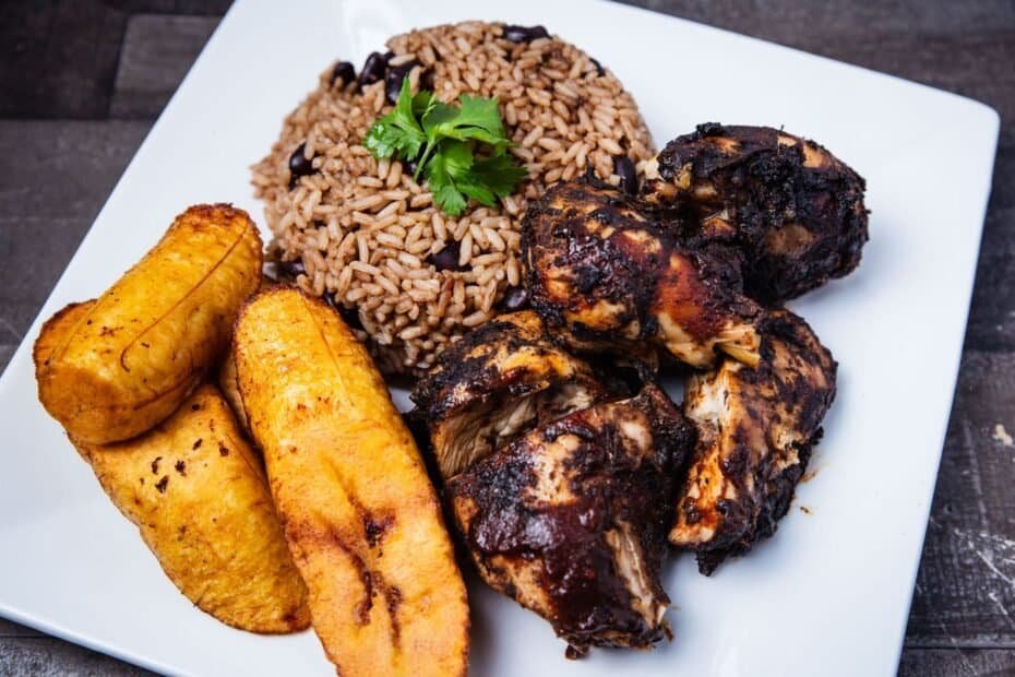 Jerk chicken with rice and peas and fried plantain